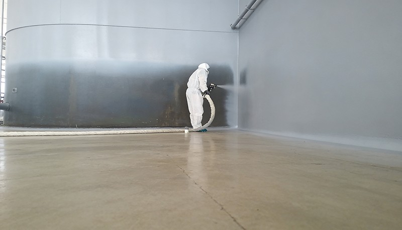 Spray polyurea protective coating applied on wall surface for industrial protection