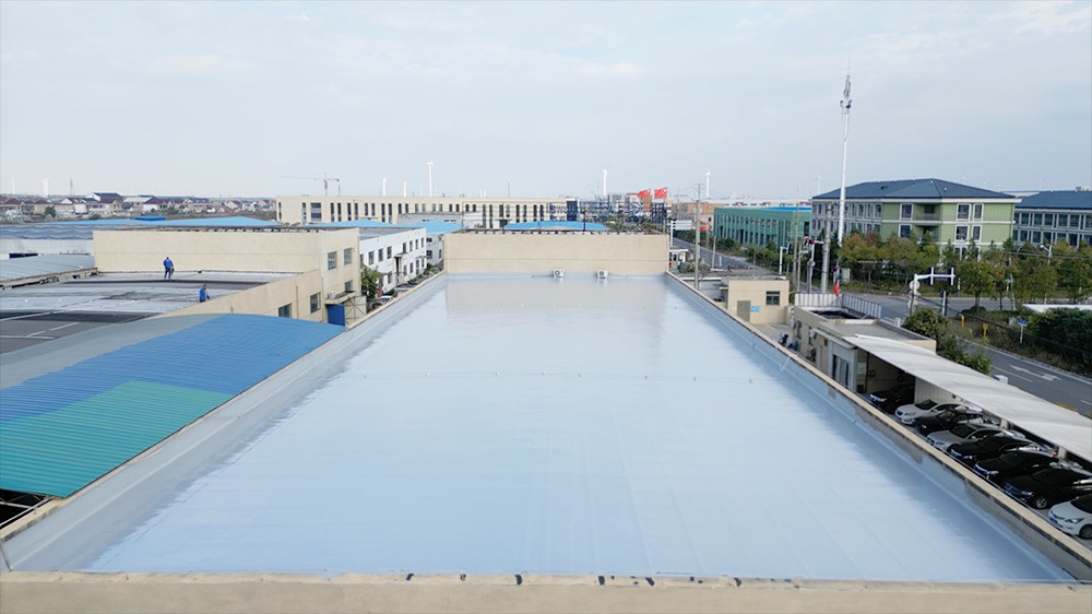 Large industrial roof with aging waterproof membrane before polyurea renovation